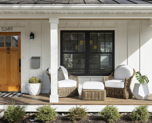 Front porch of a South Minneapolis home with cozy seating and welcoming curb appeal