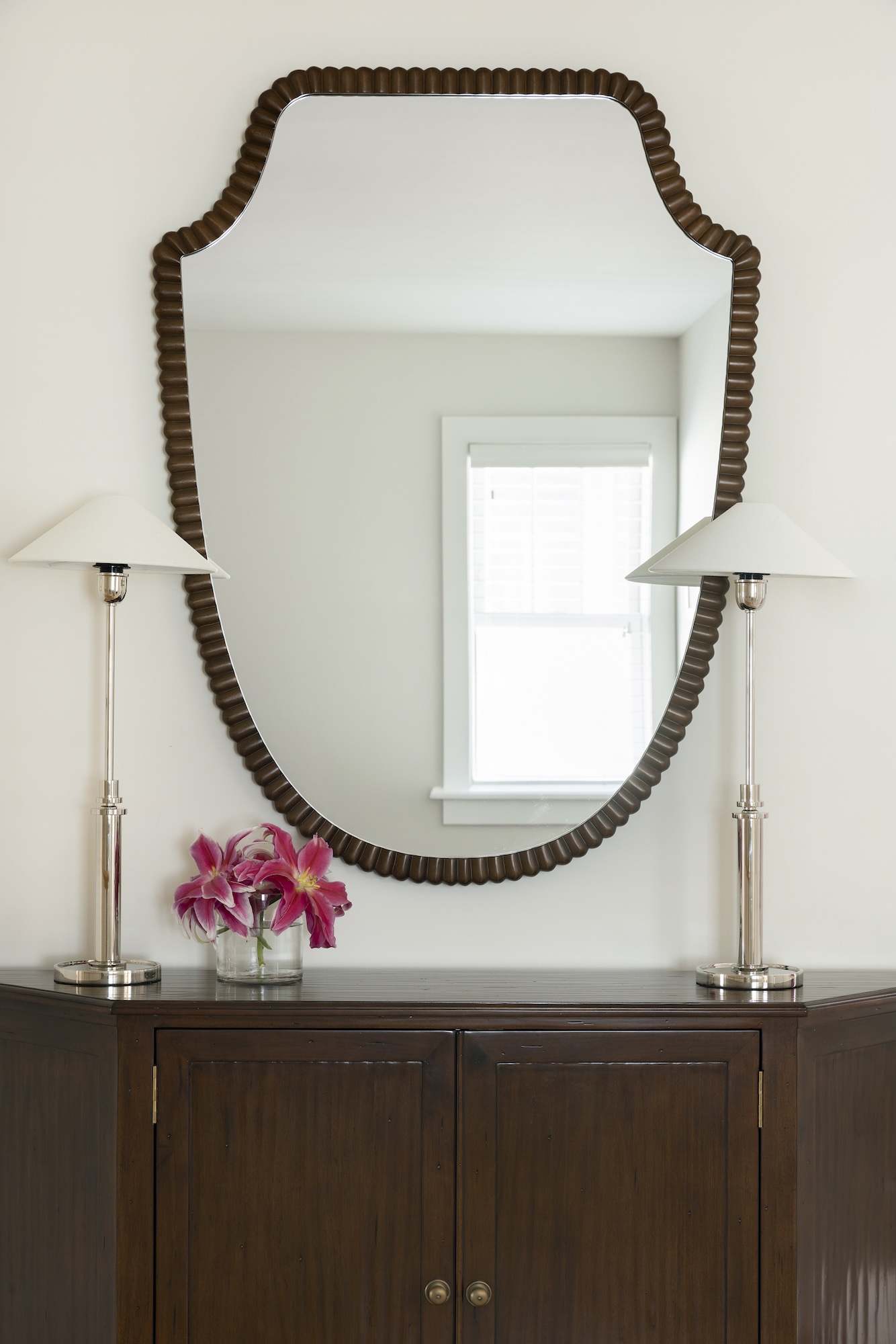 South Minneapolis home hallway featuring a decorative mirror, soft lighting, and elegant details