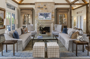 Traditional great room with a stone fireplace, flanking sofas, and warm, timeless design in Wayzata, Minnesota.