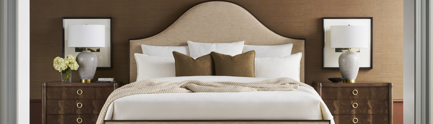 A moody bedroom that is designed by Vanguard who Traditions proudly represents on their floor.