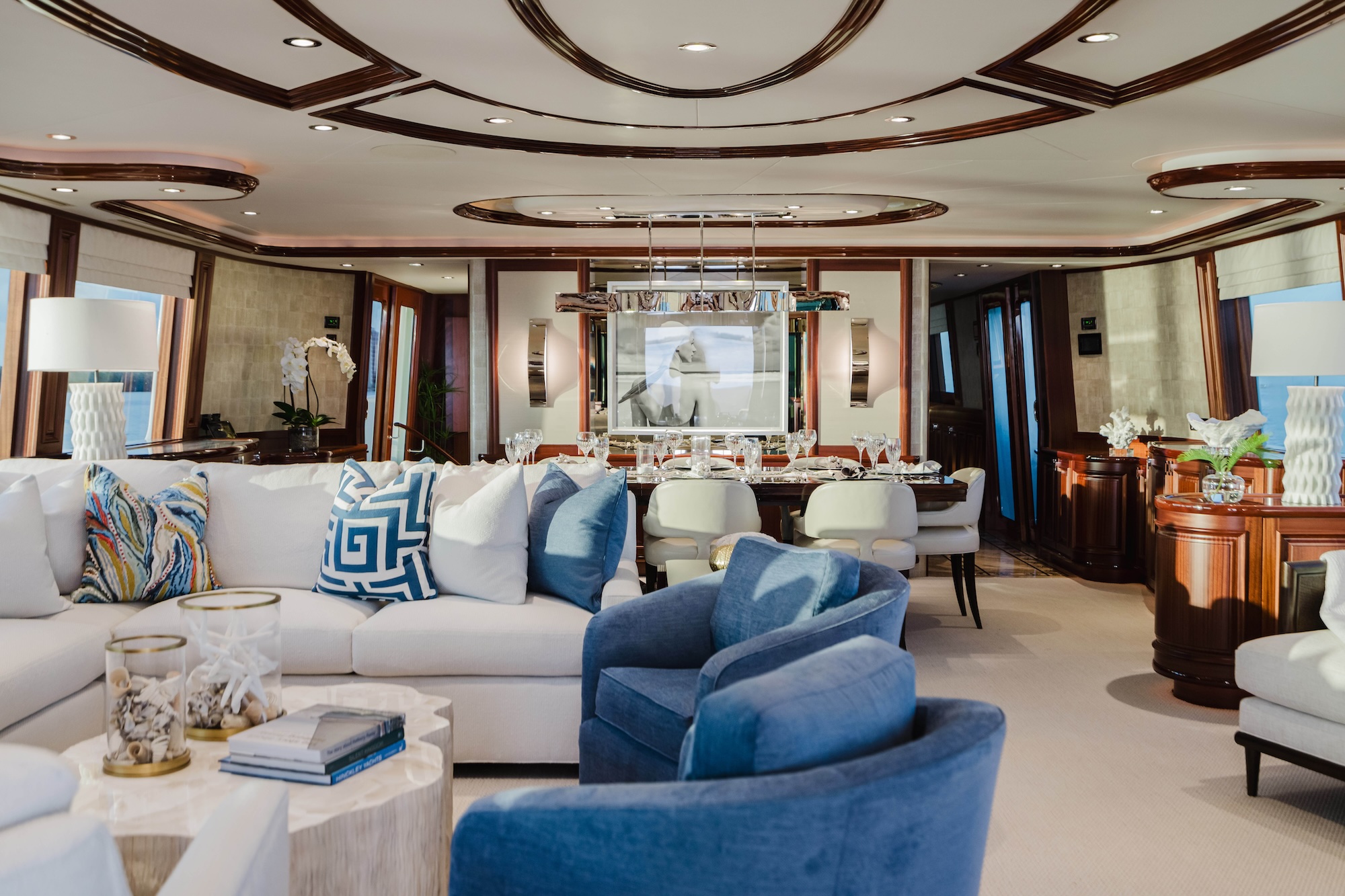 Naples yacht interior design featuring a refined main salon aboard the 112’ SeaQuinn with custom furnishings