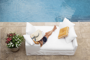 women sitting near pool in naples