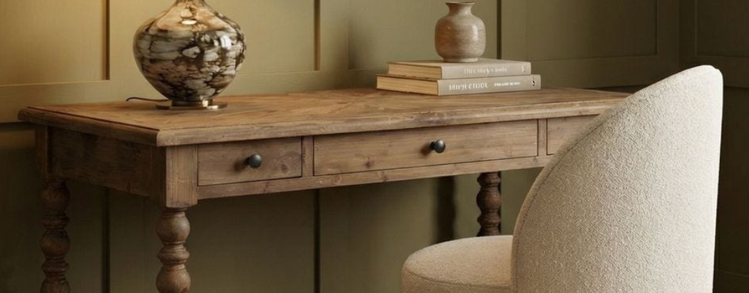 Designer home office furniture featuring a desk, chair, and bookshelves from Traditions
